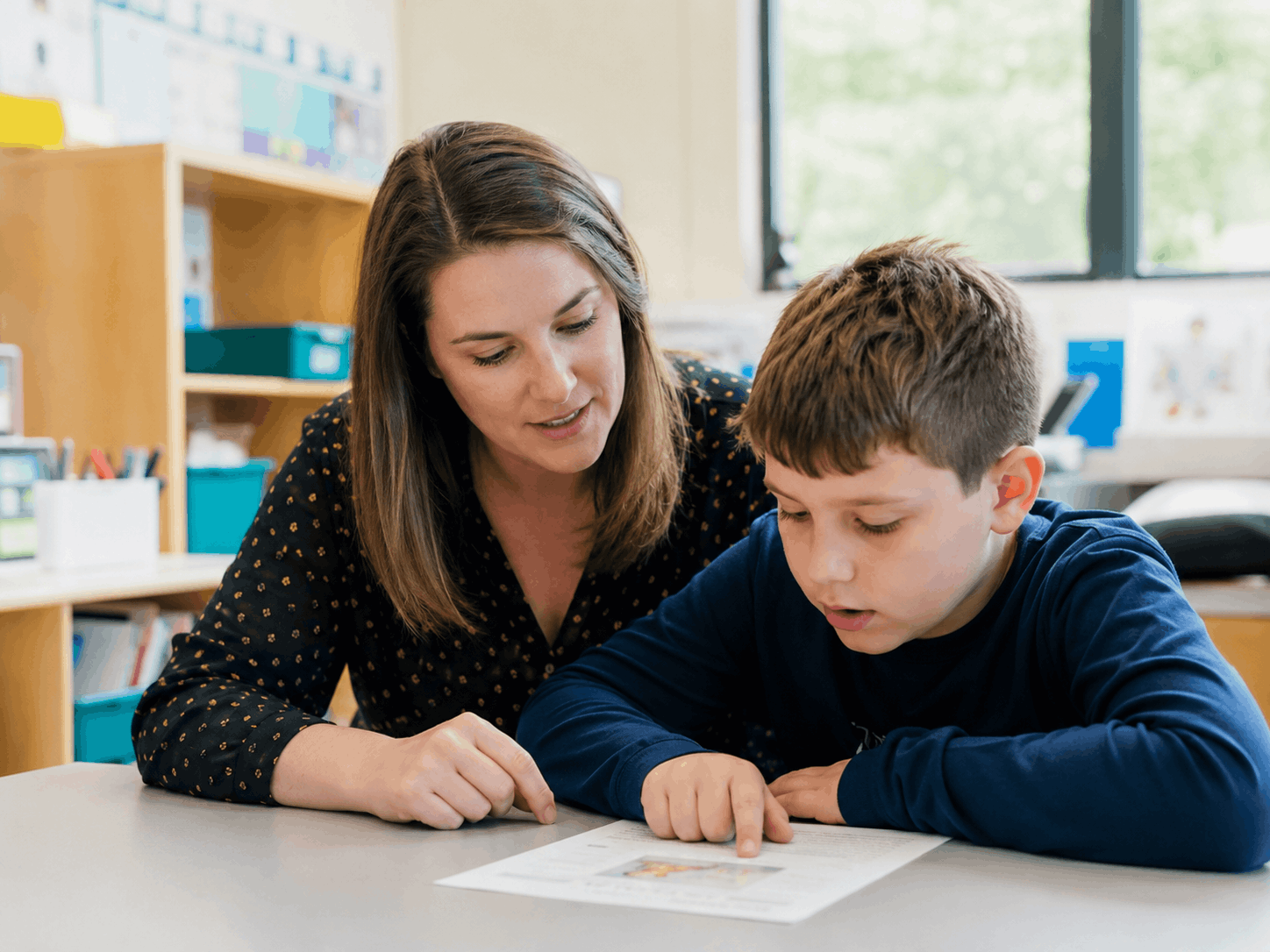 Autism family reading together at home — the everyday moments organizations help support